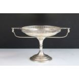 Early 20th Century silver hallmarked tazza dish having gallery sides with twin handles raised on a