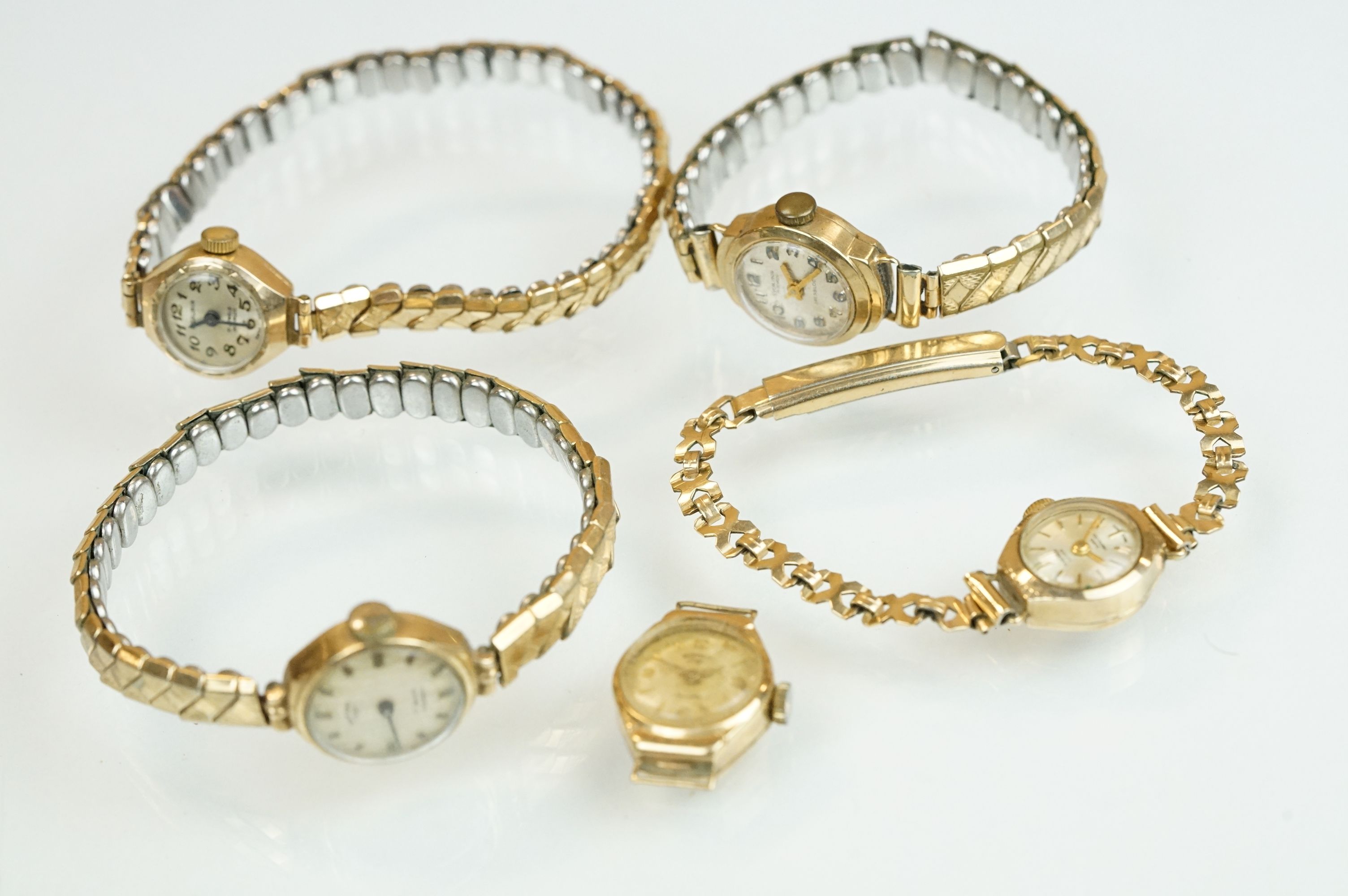 Collection of 9ct gold cased ladies cocktail watches to include Excalibur, Rotary and Lever. All