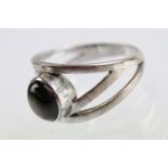 18ct white gold and brown chatoyant stone ring. The ring set with an oval cabochon to centre with