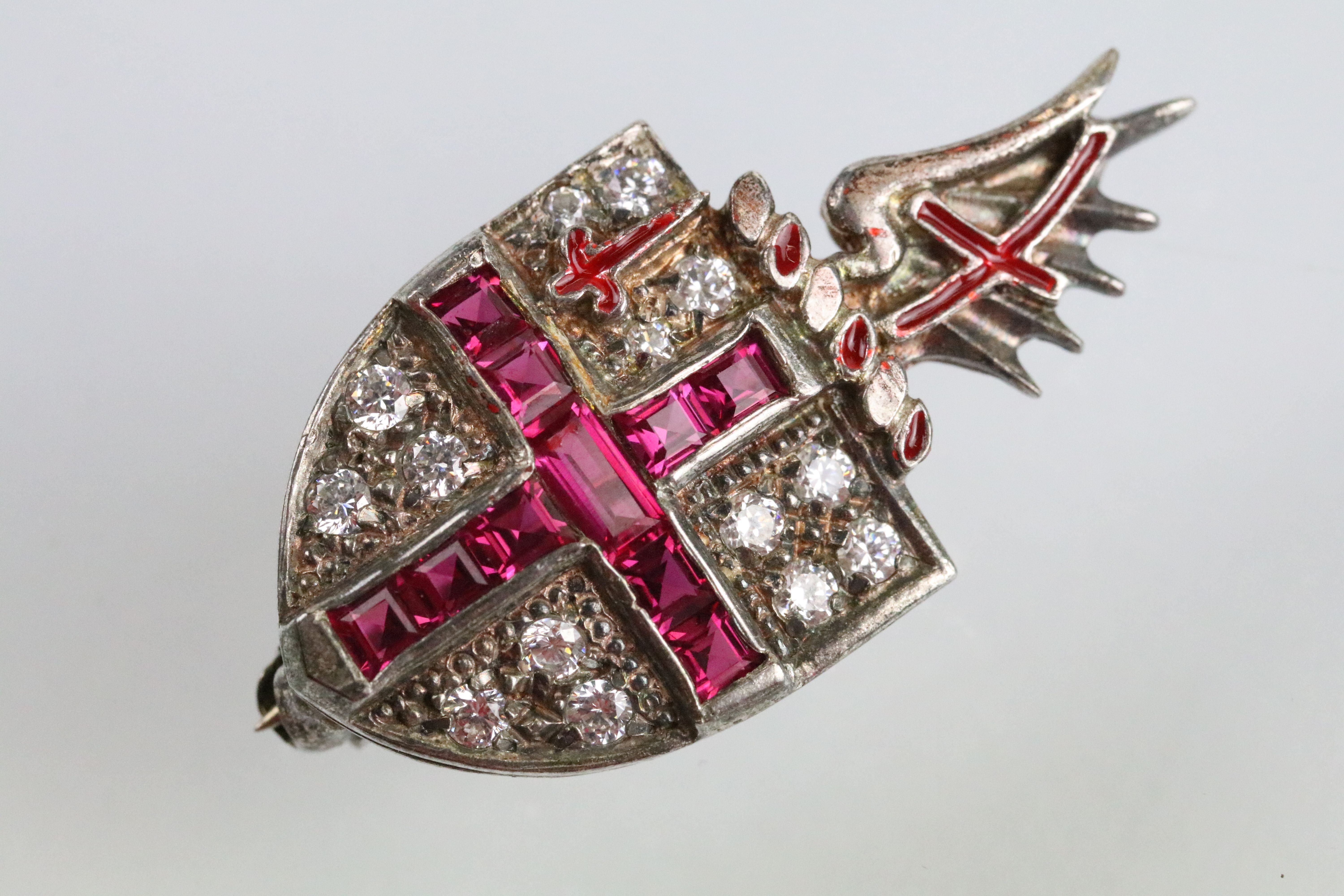 Silver ruby and white stone London coat of arms brooch. The brooch having set with step cut rubies