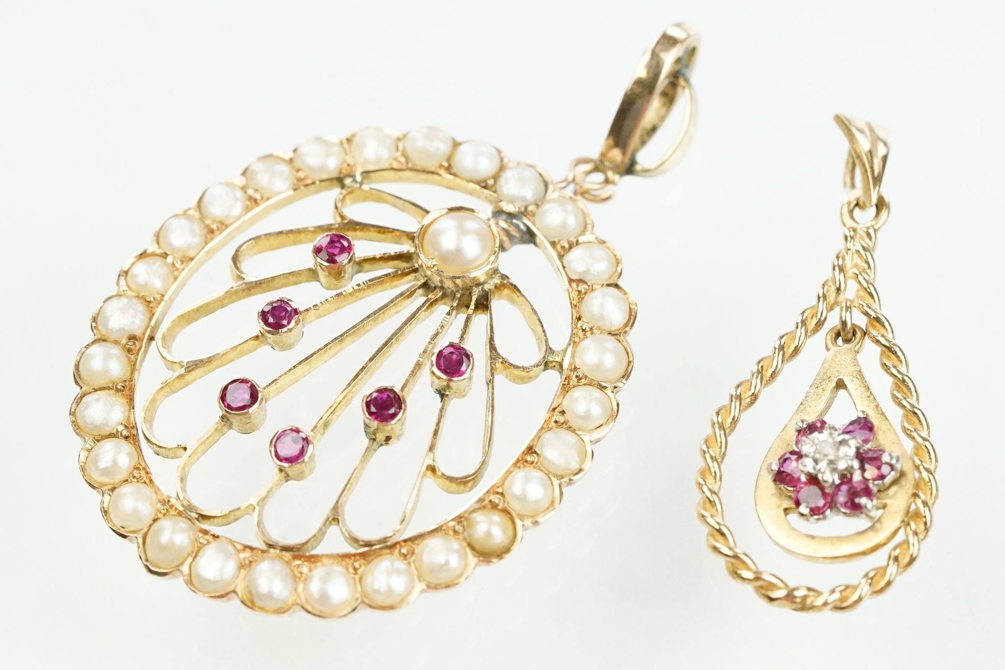 Two 20th Century pendants to include a 9ct gold drop shaped pendant with a central cluster of