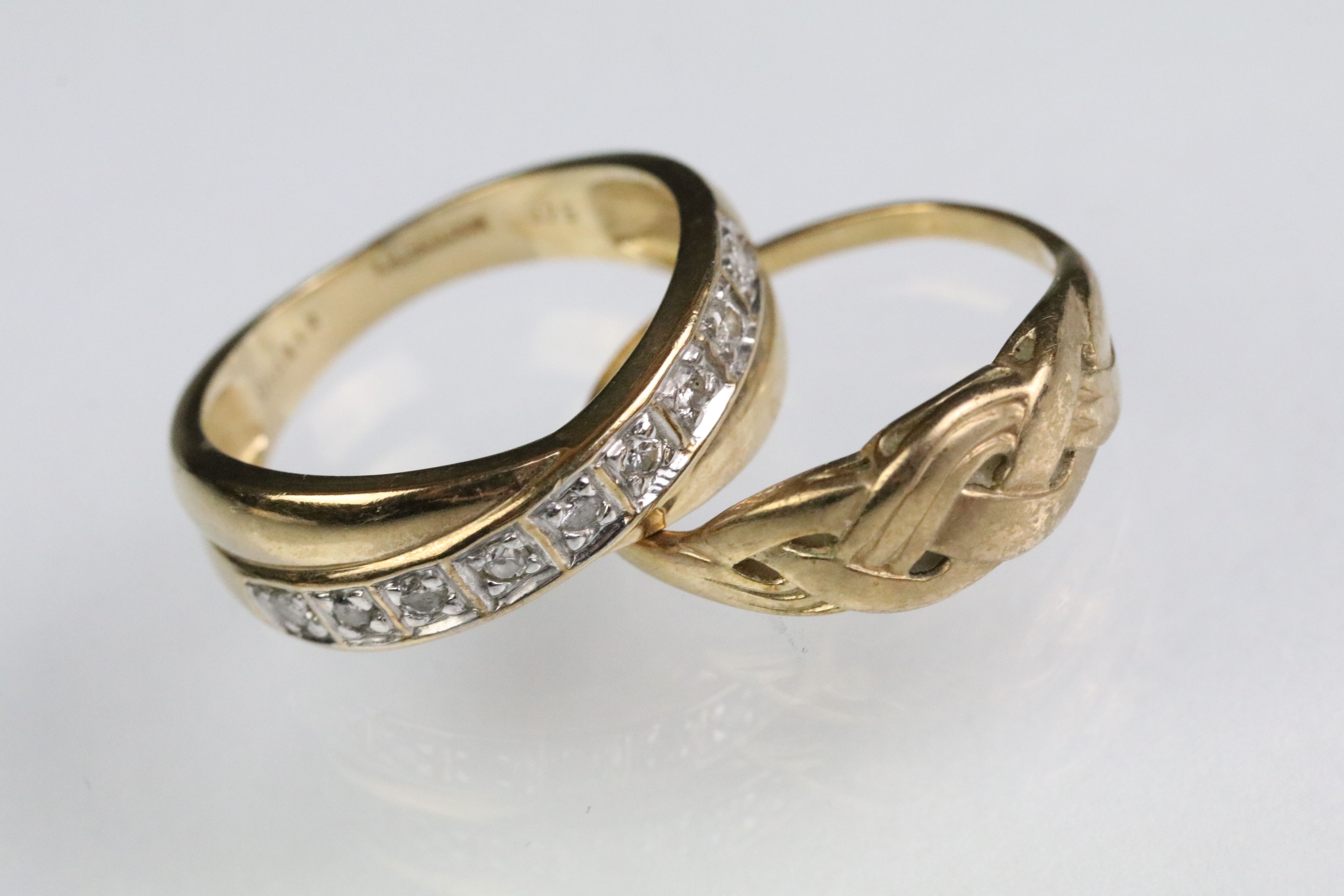 Two 9ct gold rings to include a crossover ring set with diamonds (London import marked, size K), and