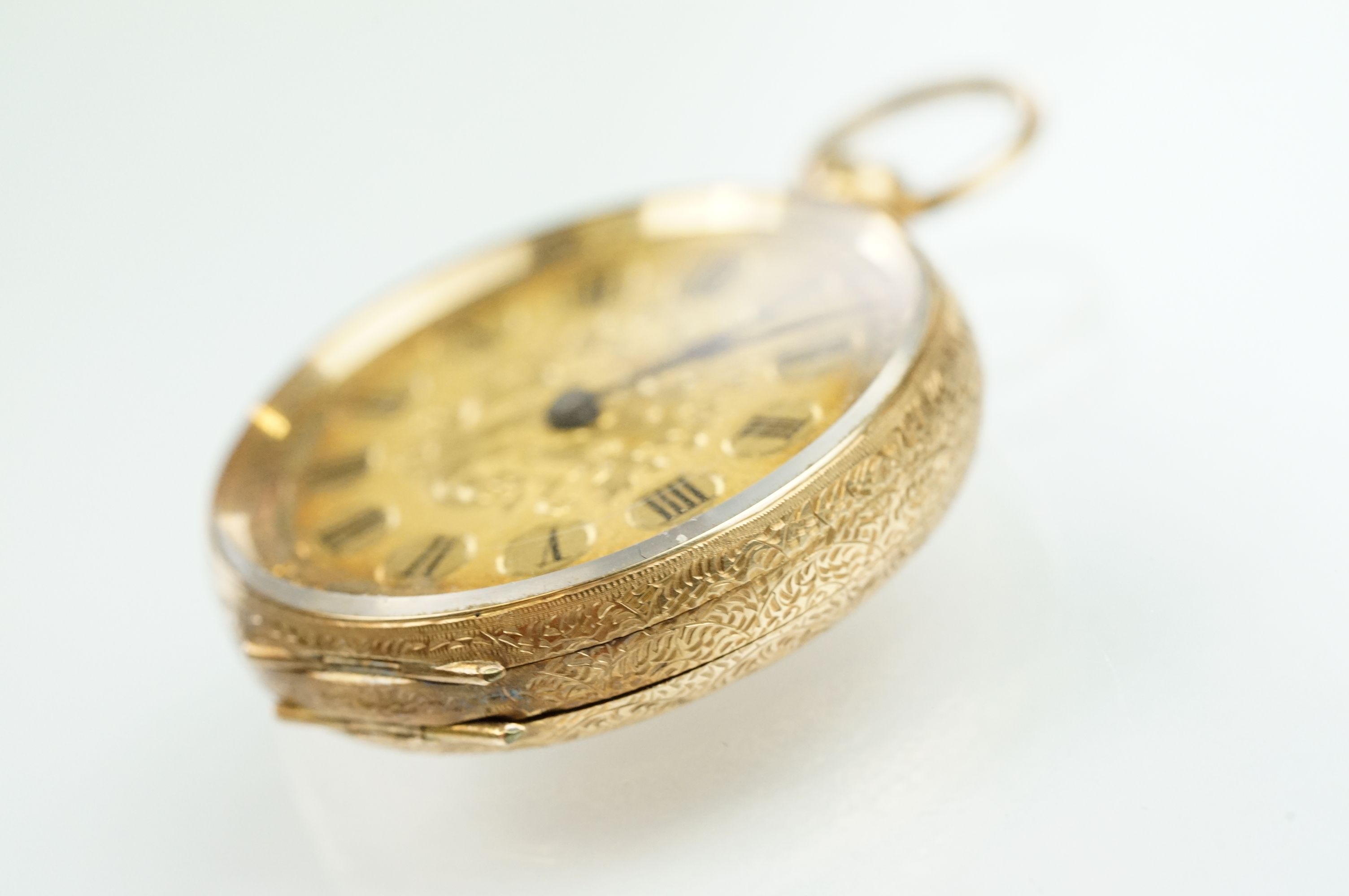 14ct gold open face pocket fob watch having a gilt face with foliate details and roman numerals to - Bild 5 aus 11