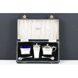 A fully hallmarked sterling silver Art Deco cruet set to include salt pot, mustard pot and pepper