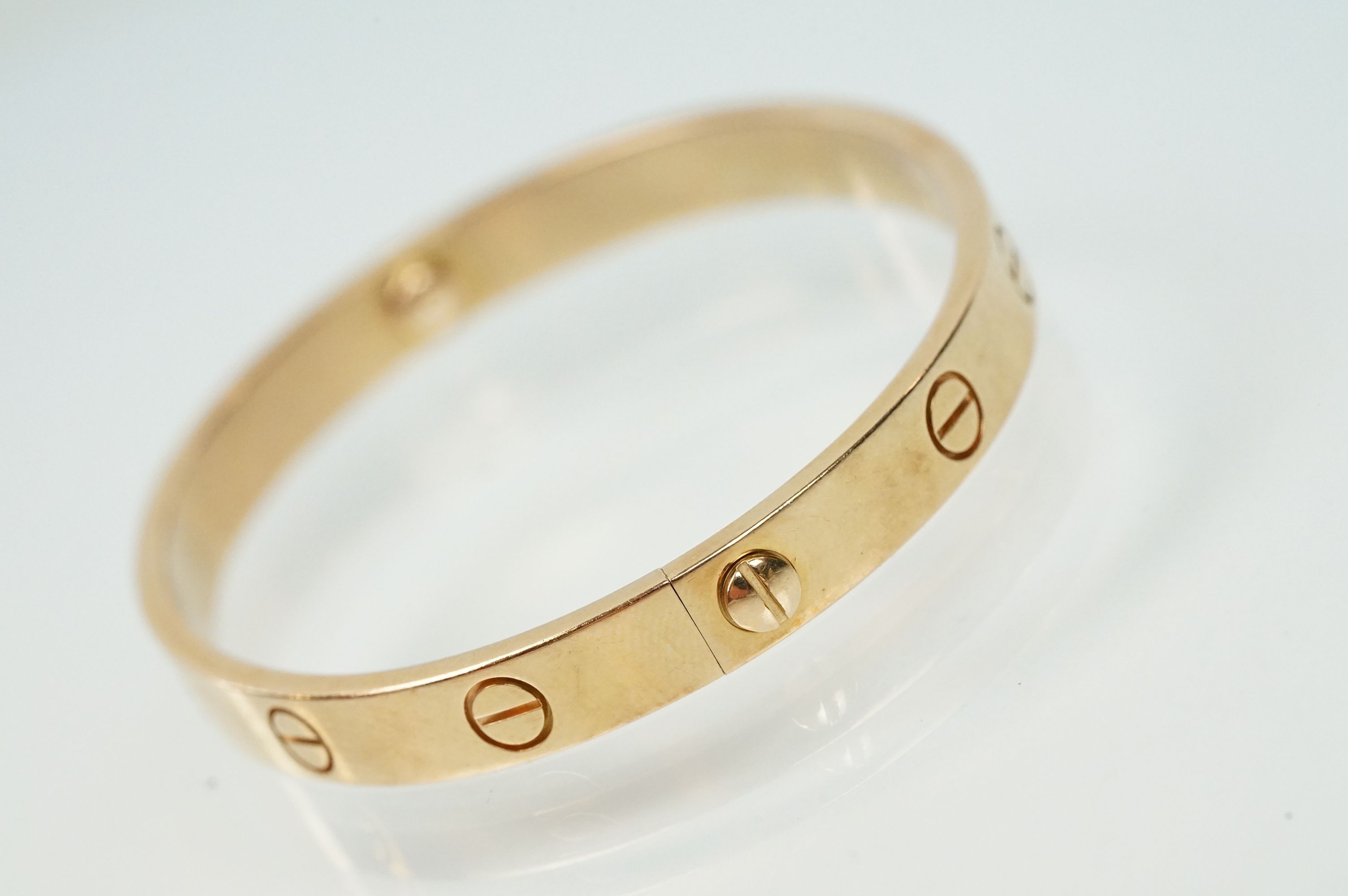 Cartier - 18ct gold 'love' bangle bracelet of oval form with screw detailing. Signed Cartier with - Image 3 of 11