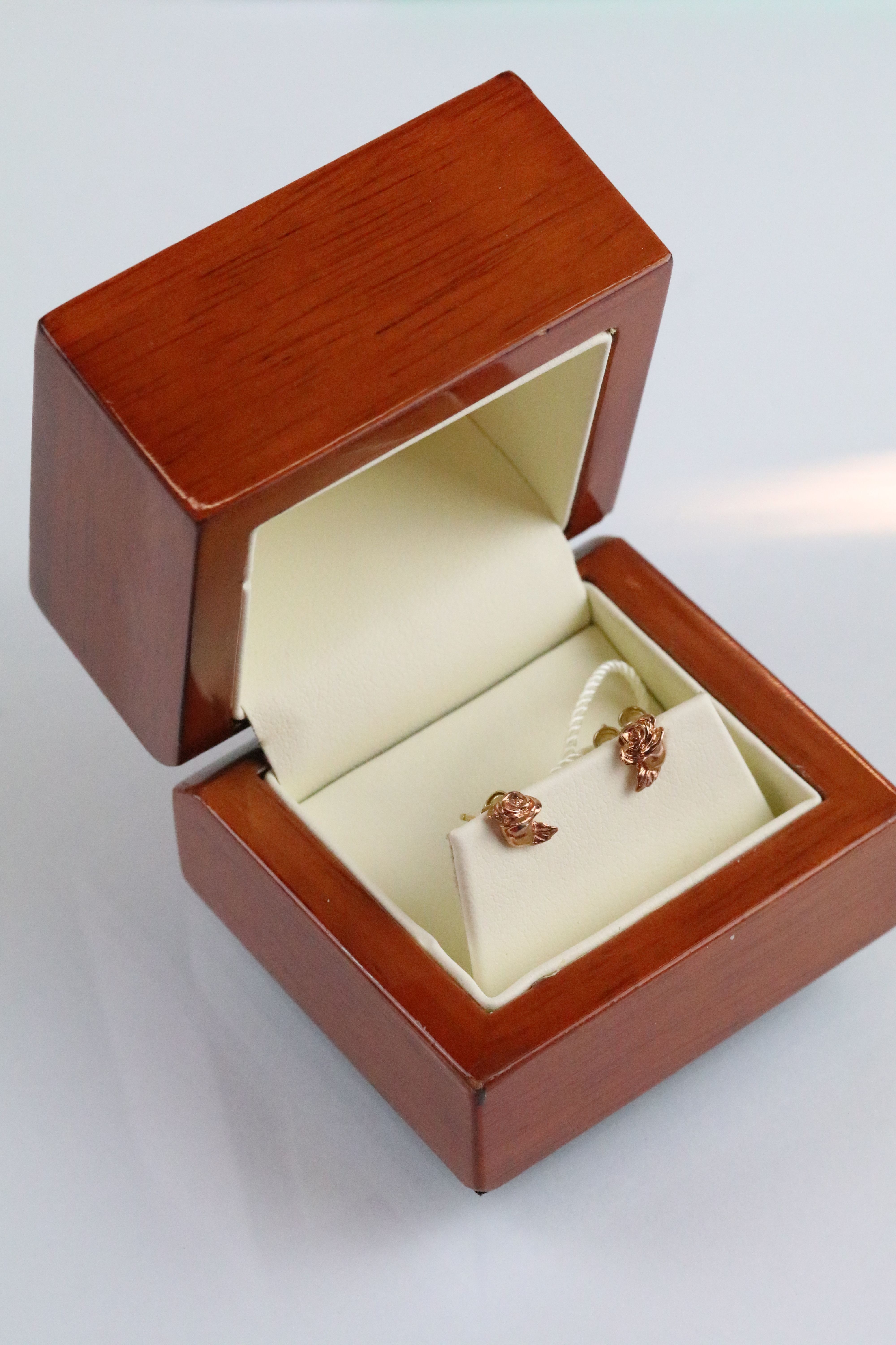 Clogau 9ct gold stud earrings in the form of roses. Complete with original packaging. Marked Clogau,