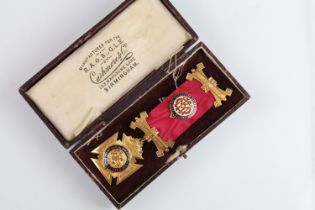 Royal Order of Buffaloes 9ct gold and enamel medal mounted to a red ribbon within leatherette box.