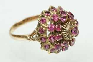 14ct gold Thai Princess ring being set with terraced round cut rubies to a plain shank. Marked