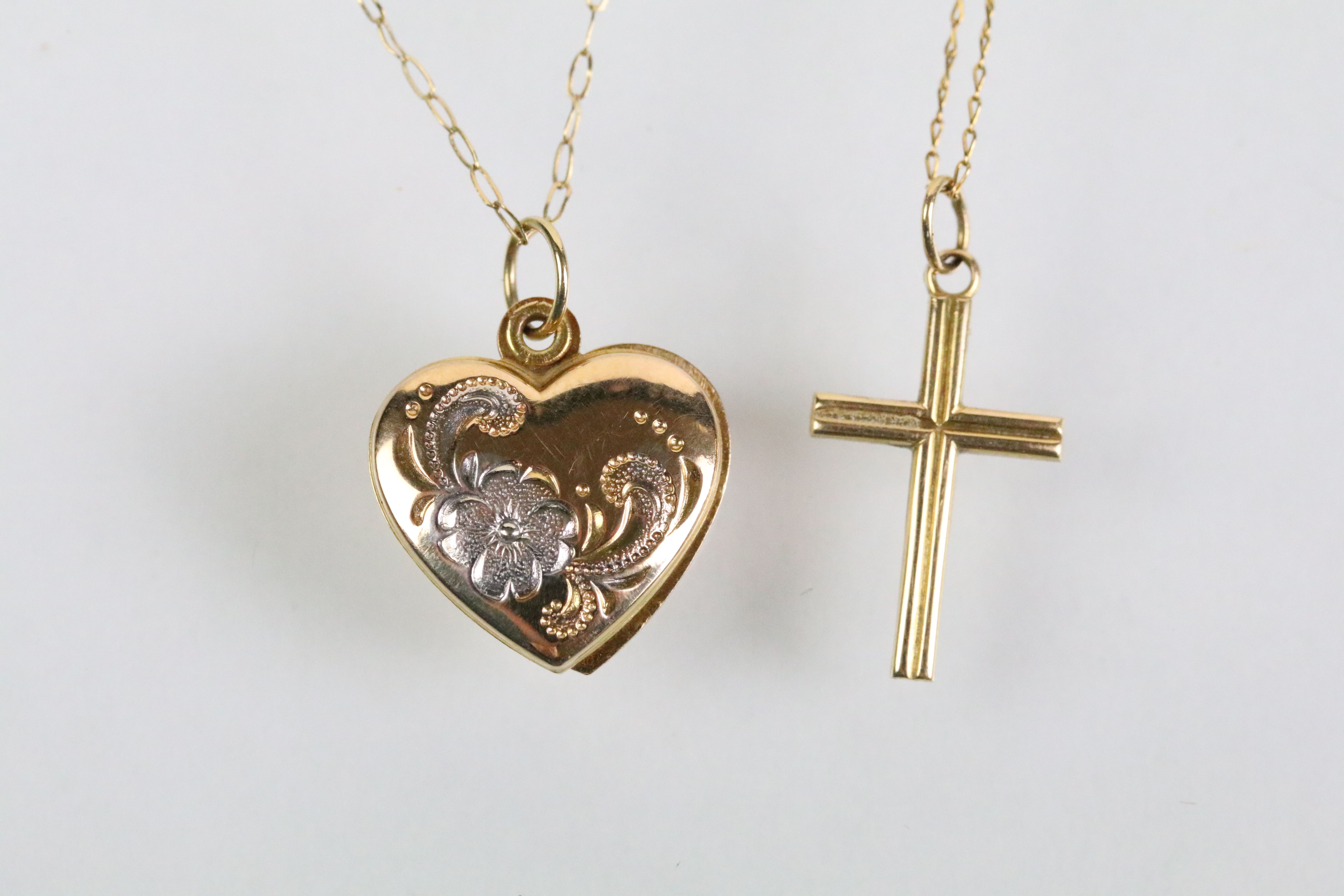 Two 9ct gold pendant necklaces to include a cross pendant on a fine link chain (cross hallmarked