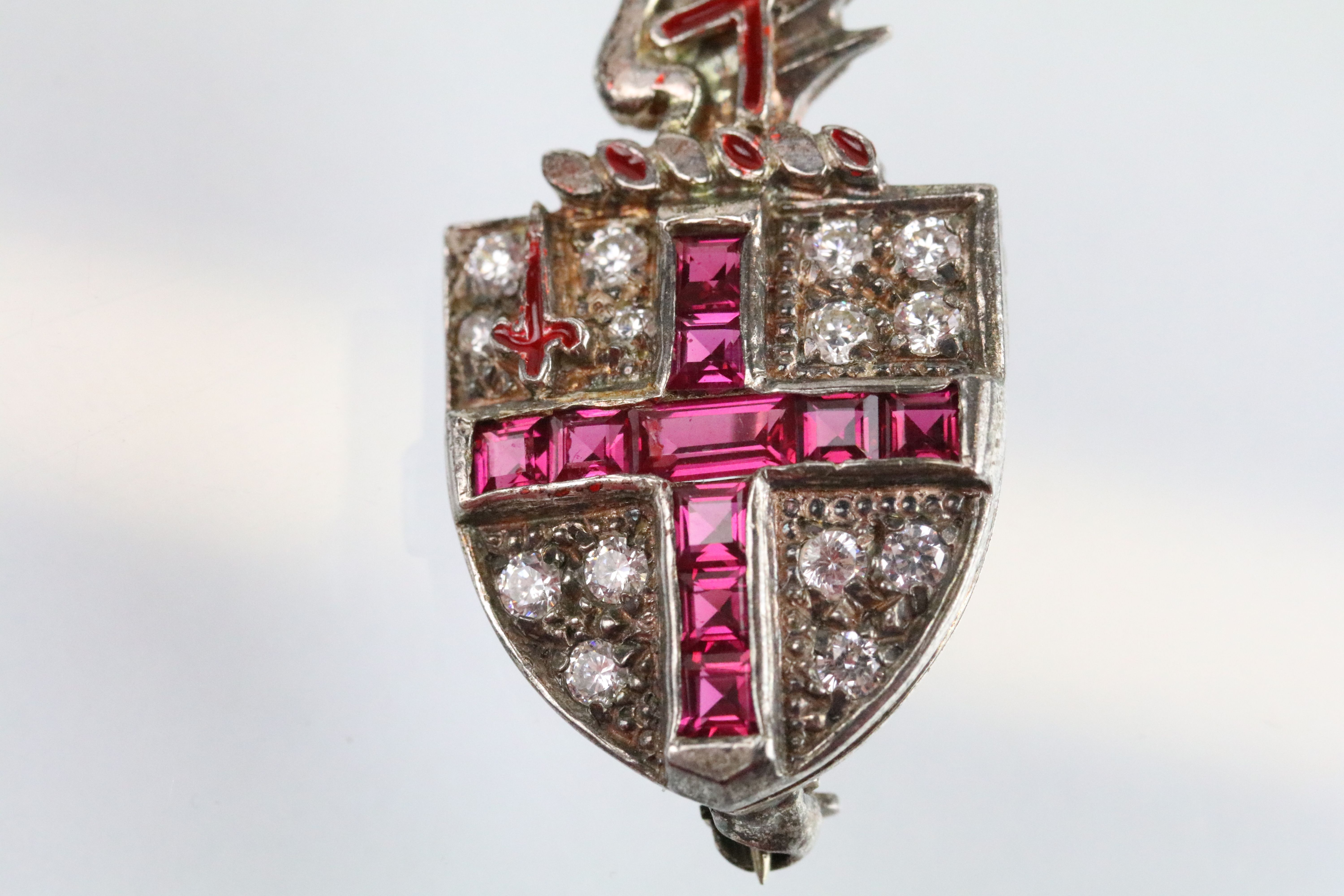 Silver ruby and white stone London coat of arms brooch. The brooch having set with step cut rubies - Image 2 of 4