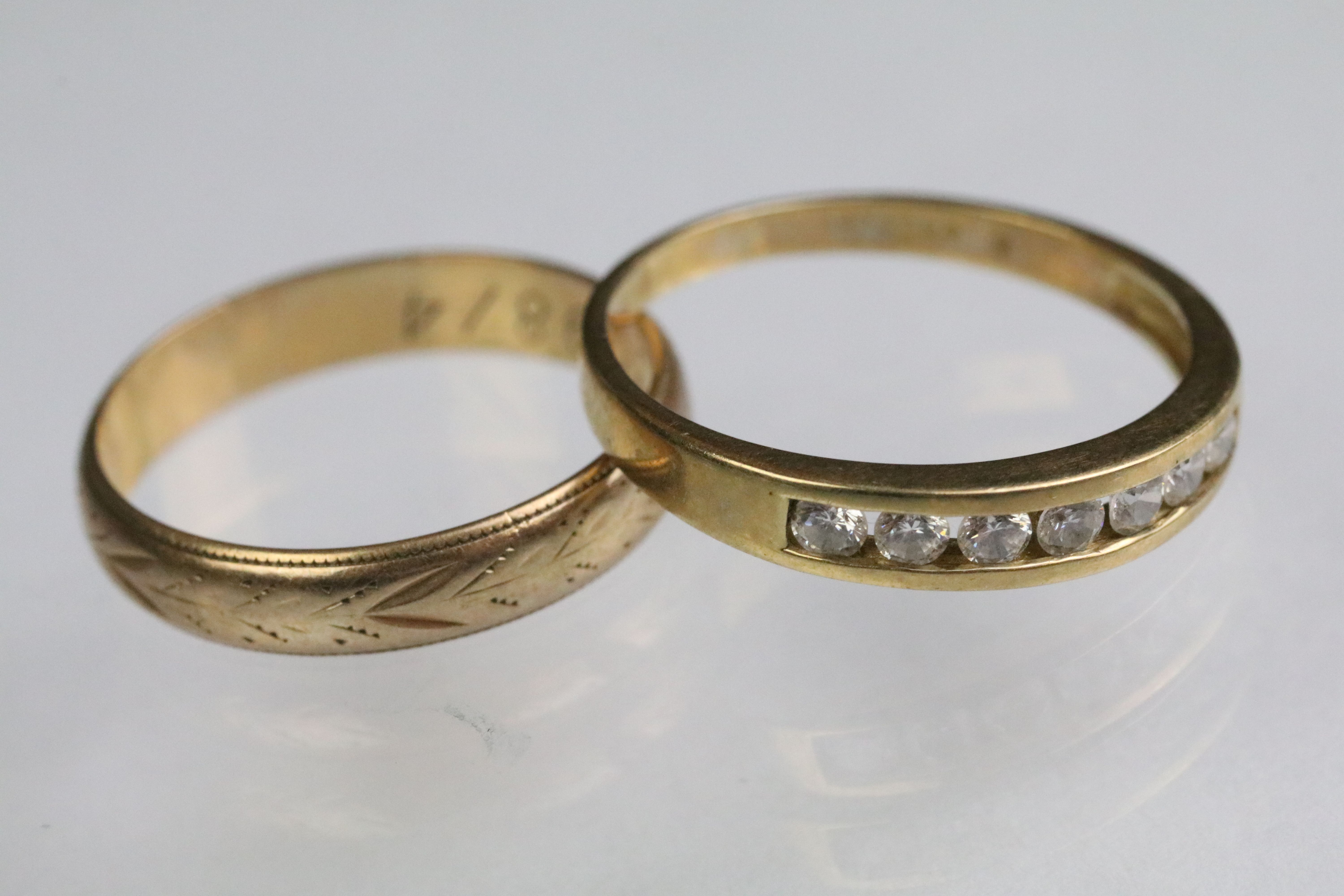 Two 9ct gold rings to include a 9ct gold and cz seven stone ring (import marked 1991, size O.5)