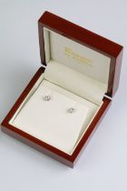 Pair of diamond stud earrings with 18ct gold posts. Each diamond estimated 0.30ct, 0.60ct in