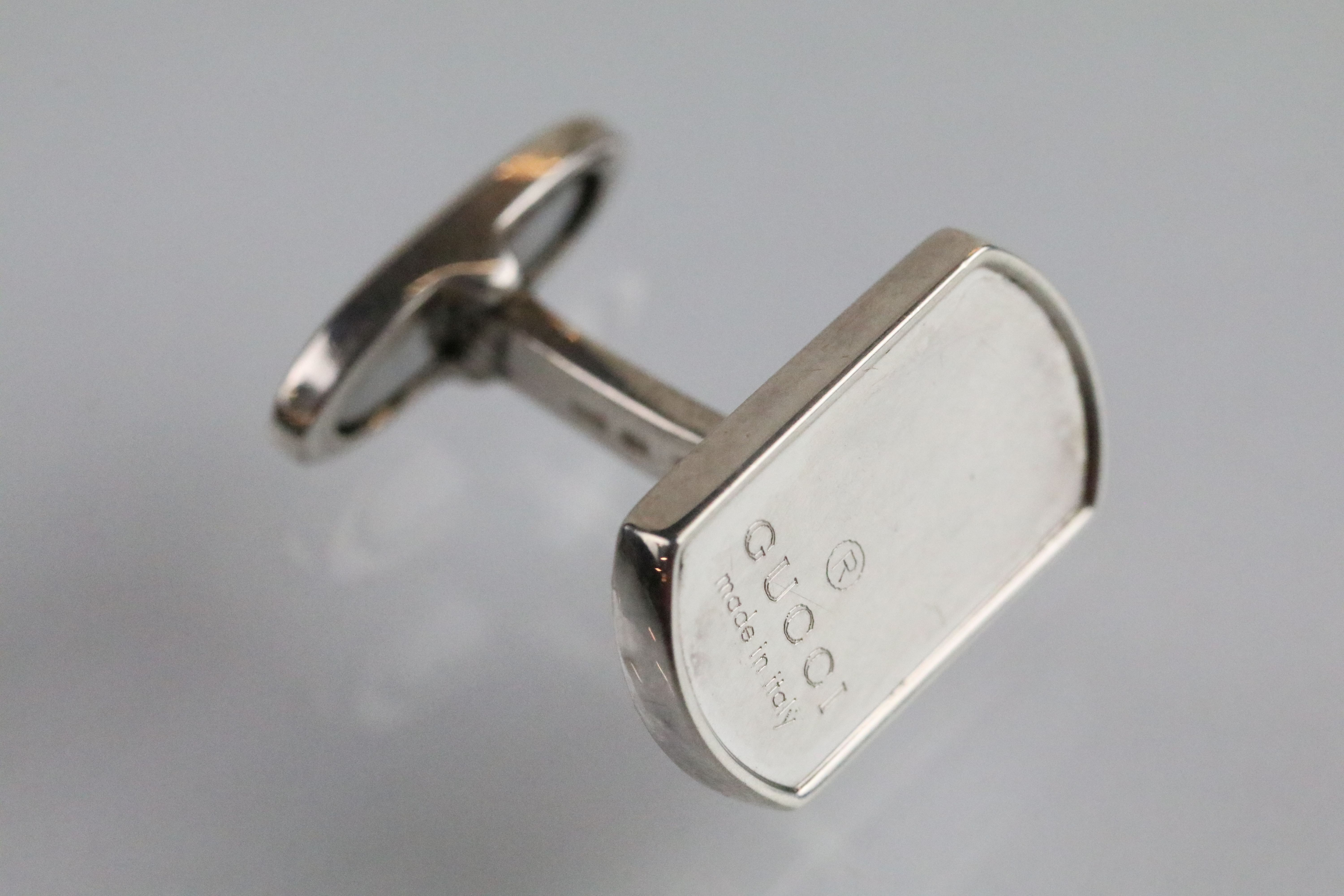 Gucci - a pair of silver cufflinks having rectangular heads engraved Gucci with hinged fasteners. - Image 3 of 4