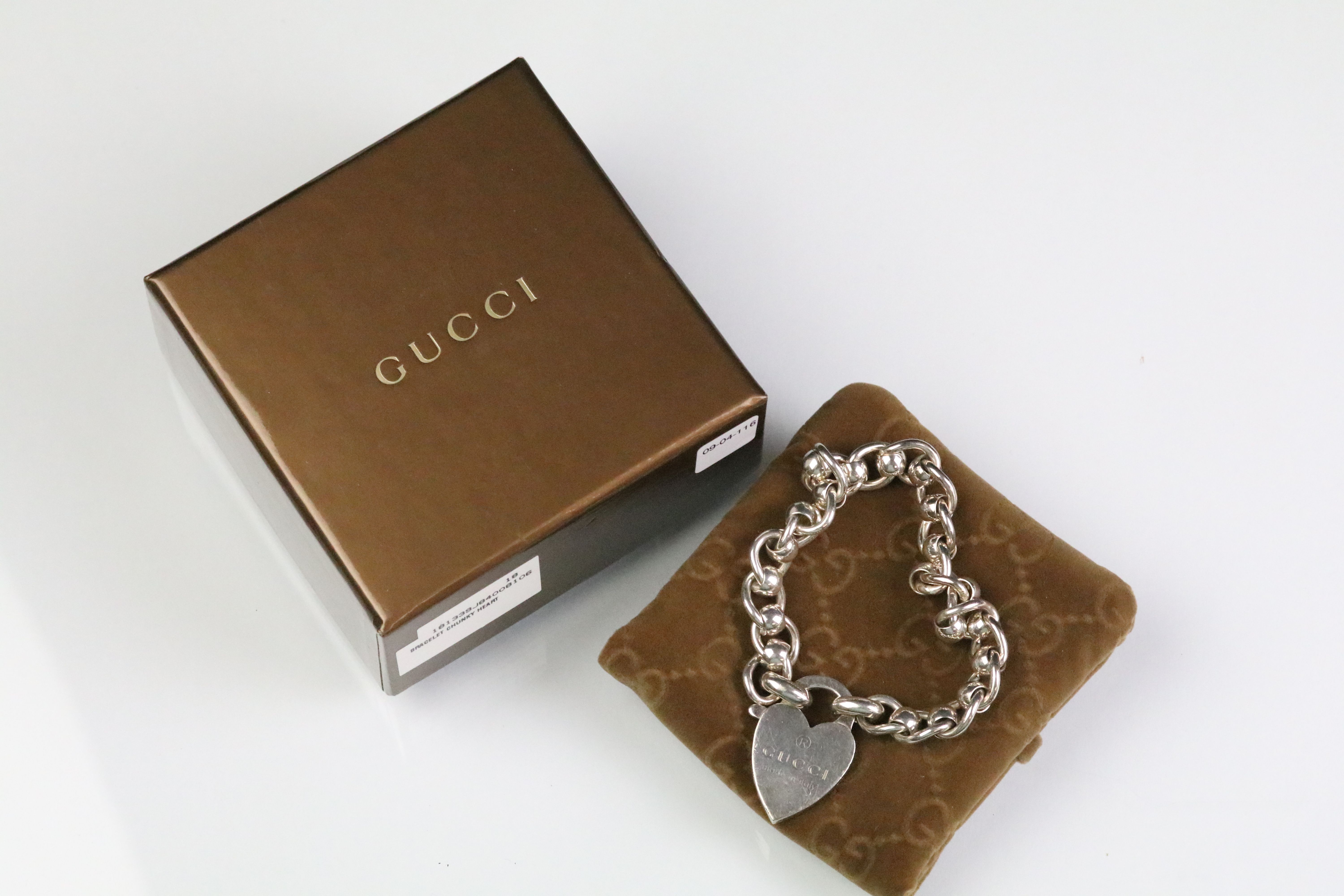 Gucci silver chunky heart bracelet having a heart padlock clasp complete with original box. Heart