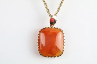 9ct gold rope twist necklace chain with spring ring clasp having a large carnelian panel pendant.