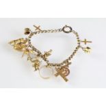 Antique charm bracelet having twelve charms (eleven marked 9ct gold) mounted to a belcher link chain
