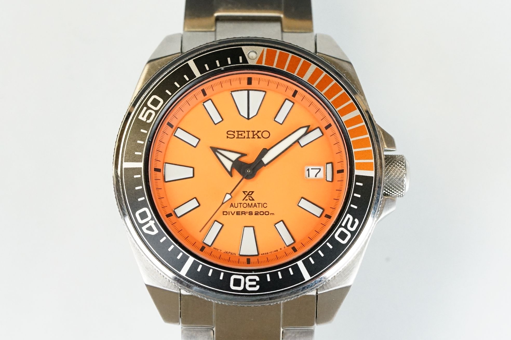 A gents Seiko automatic 200m divers watch, orange dial with black & orange rotating bezel, date