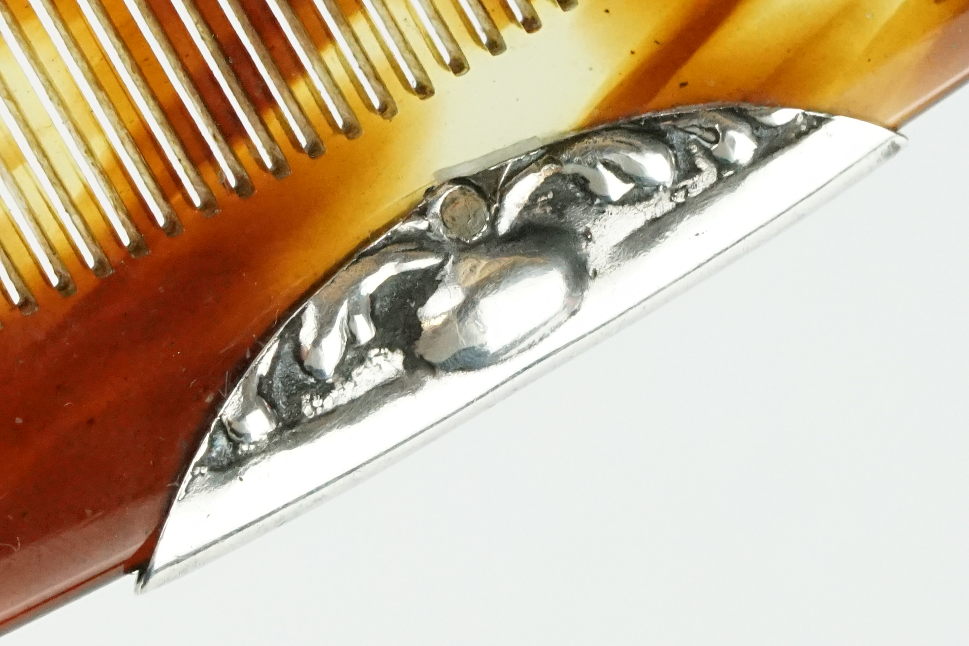 An antique sterling silver repoussé pattern hair comb and case. - Image 11 of 12