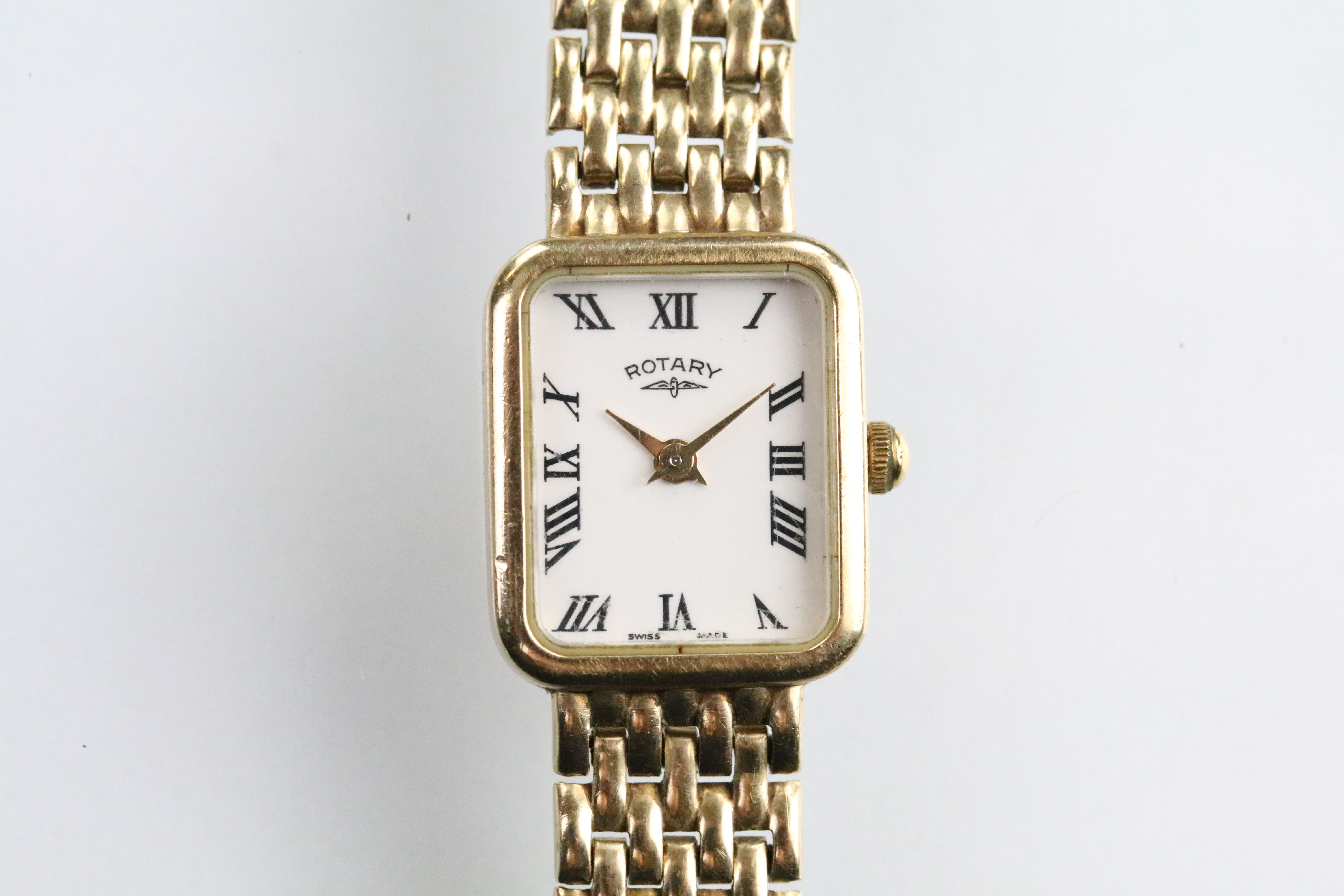 Rotary 9ct gold ladies wrist watch having a rectangular face with roman numerals to the chapter ring