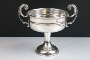 1920s William Hutton & Sons silver hallmarked trophy cup having twin scrolled handles raised on a