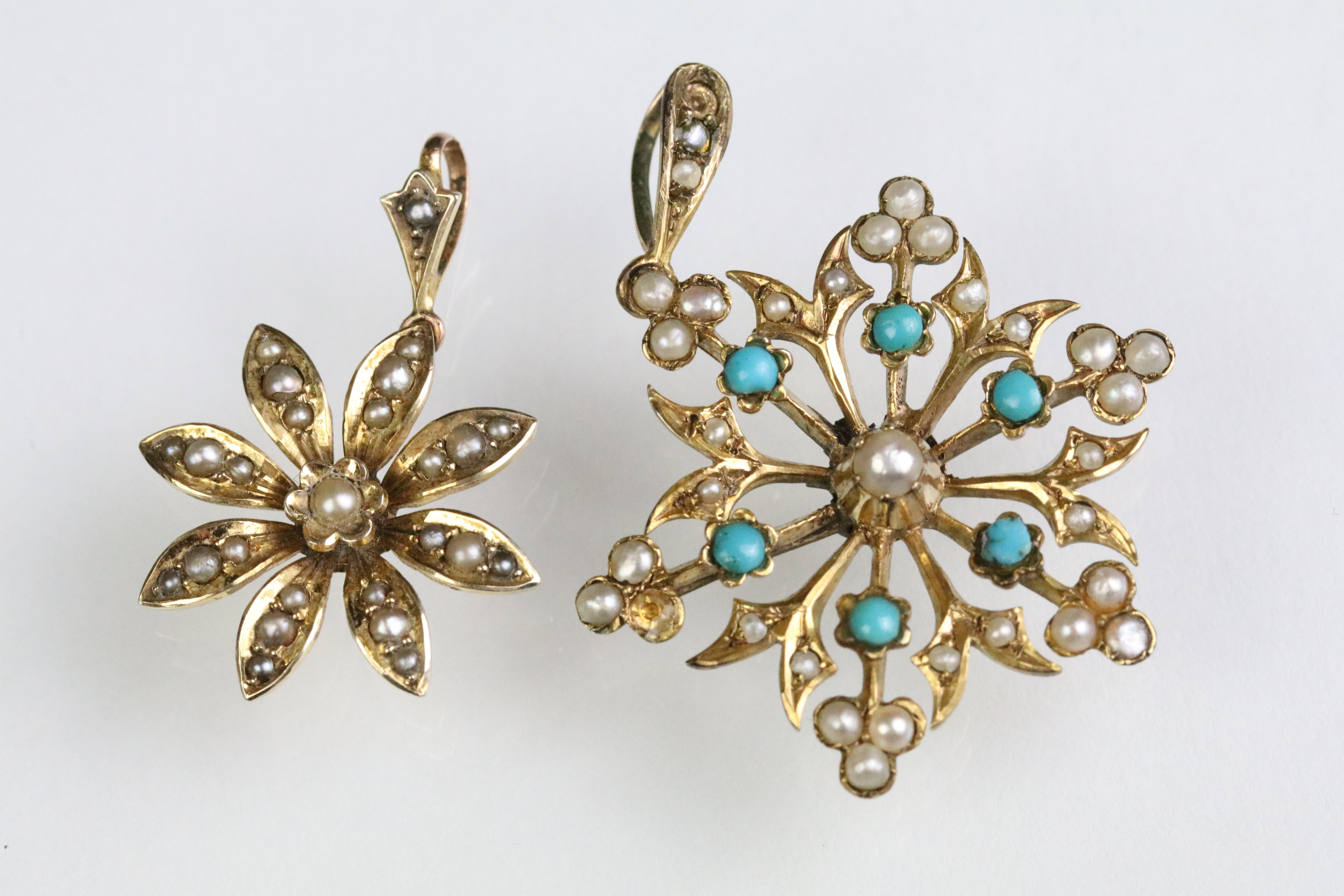 Two early 20th Century floral pendants to include a turquoise and pearl set example, and a pearl