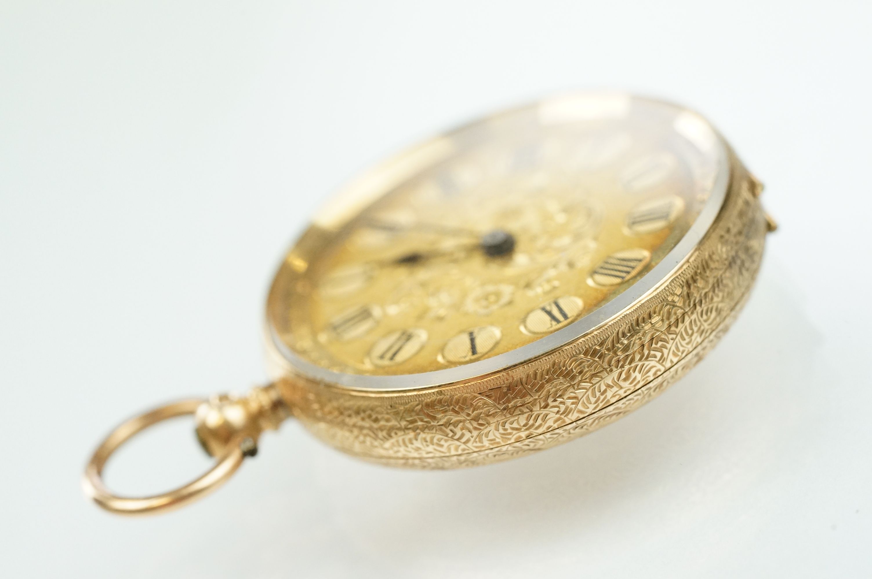 14ct gold open face pocket fob watch having a gilt face with foliate details and roman numerals to - Bild 4 aus 11