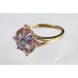 9ct gold amethyst and pink stone cluster ring. The ring being set with four marquise cut amethysts