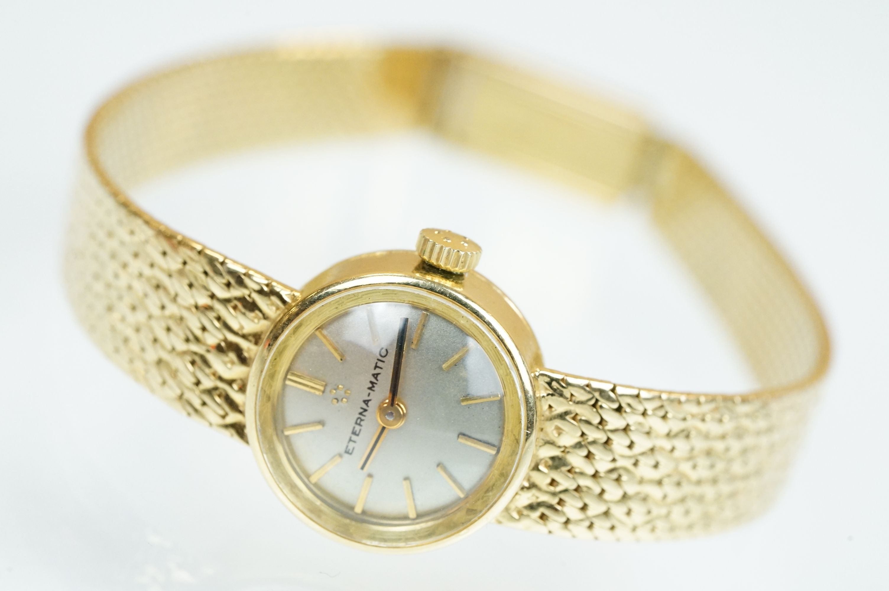 18ct gold ladies Eterna-matic 18ct gold cocktail wrist watch having a round face with baton