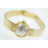 18ct gold ladies Eterna-matic 18ct gold cocktail wrist watch having a round face with baton