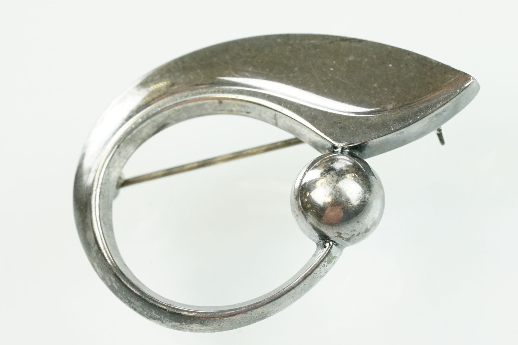 Hans Hansen Danish silver brooch of stylised form. Hinged pin an rollover clasp to verso. Signed