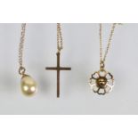 Three pendant necklaces to include a 9ct gold cross pendant (marked 9ct to pendant and chain), 9ct