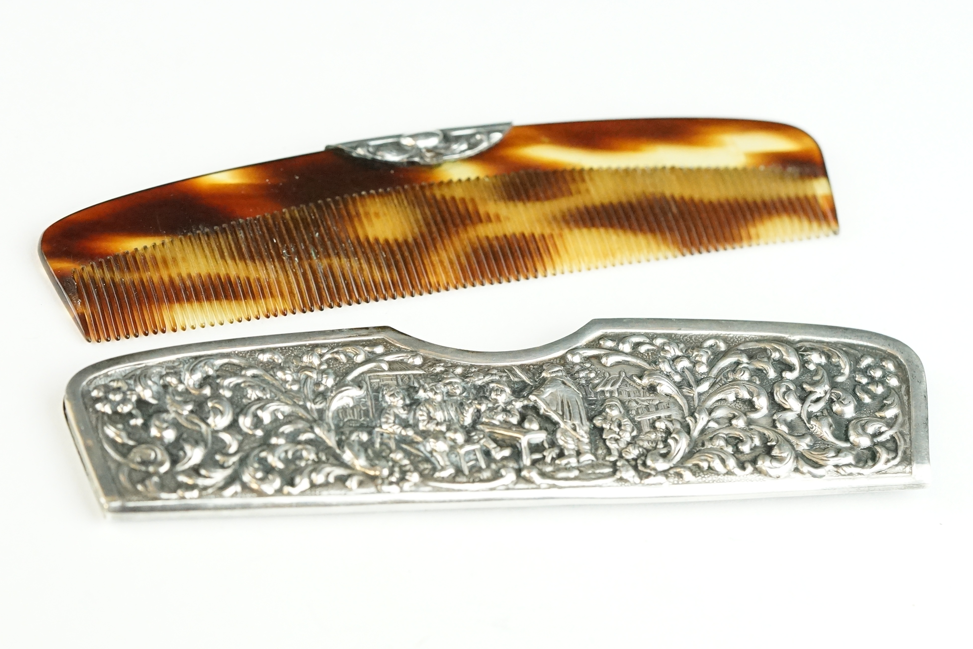 An antique sterling silver repoussé pattern hair comb and case. - Image 2 of 12