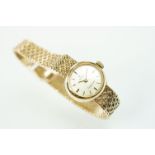 Omega Ladymatic 9ct gold wrist watch having a round face with baton markers to the chapter ring, and