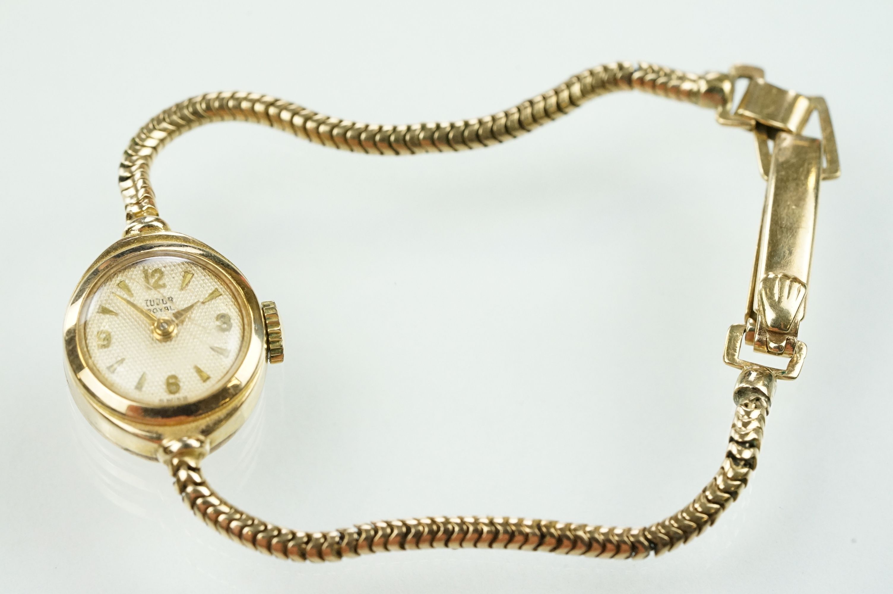 9ct Tudor Royal wrist watch having a round face with baton markers to the chapter ring on a snake