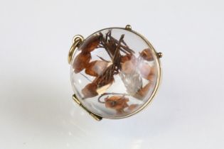 19th Century Victorian pool of light rock crystal locket of orb shape with 9ct gold banding, housing
