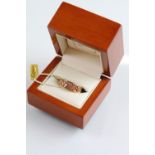 Clogau 9ct gold two tone and diamond ring. The ring having a pierced floral design with diamond