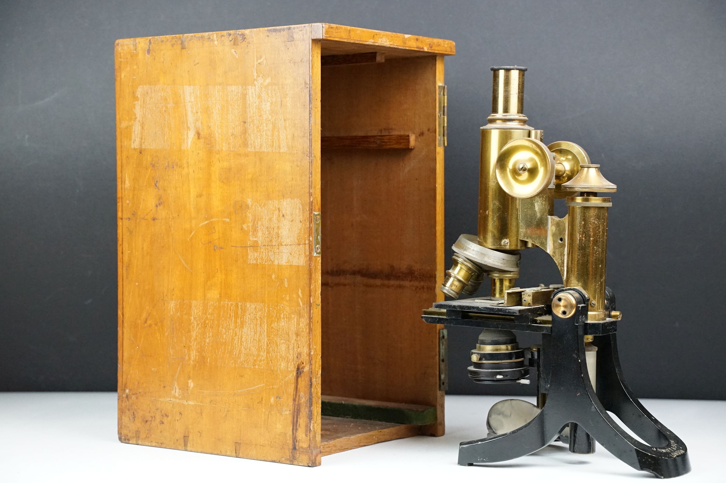 J. Swift & Son of London brass lacquered microscope, housed within a wooden carry case (missing