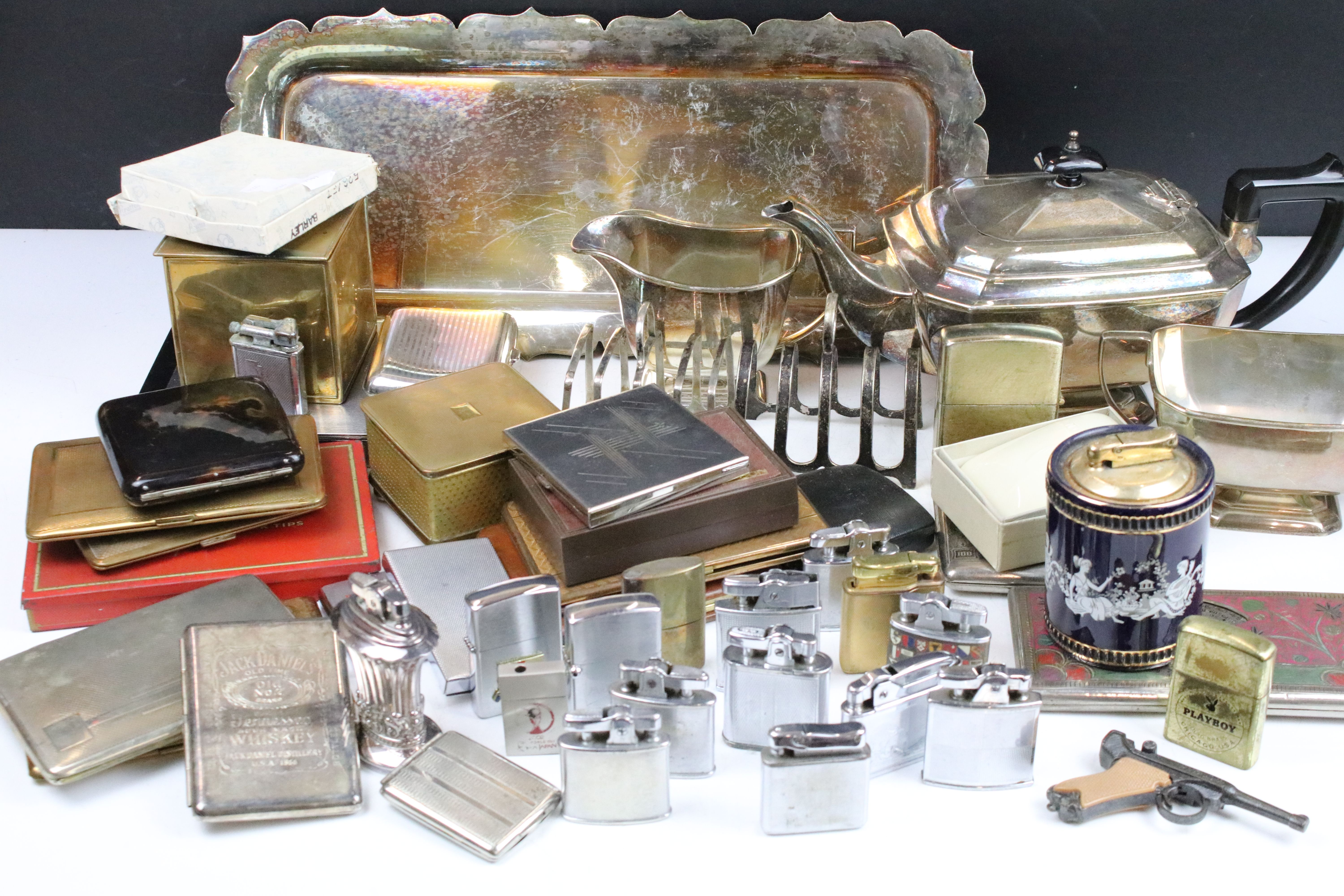 Mixed collectables to include a silver toast rack, lighters (featuring Ronson), cigarette cases /