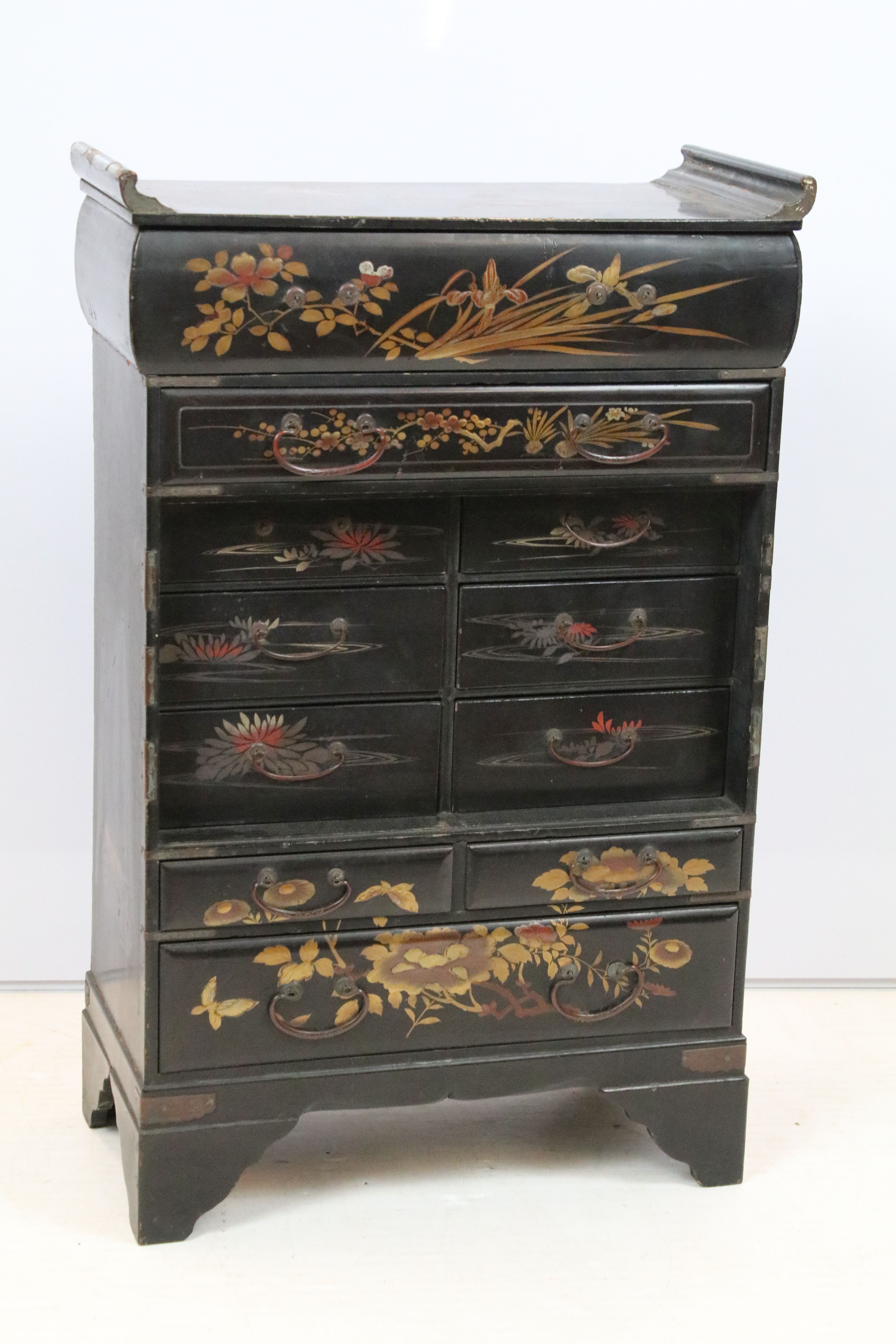 Oriental lacquered cabinet, the japanned surface painted with flowers and branches, with an