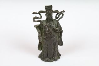 A Chinese bronze figure in the traditional style, stands approx 9.5cm in height.