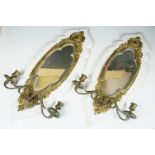 Pair of gilt metal girondel wall mirrors with bevelled glass, each with two branch candle sconces,