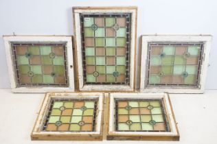 Five stained glass window panels, the largest 73 x 50cm overall