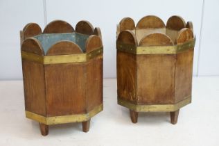 Pair of planters of planked form, with coopered banding on square tapering legs, one with lead