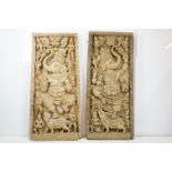 Pair of large Indian carved wooden panels depicting Ganesh surrounded by various figures, each
