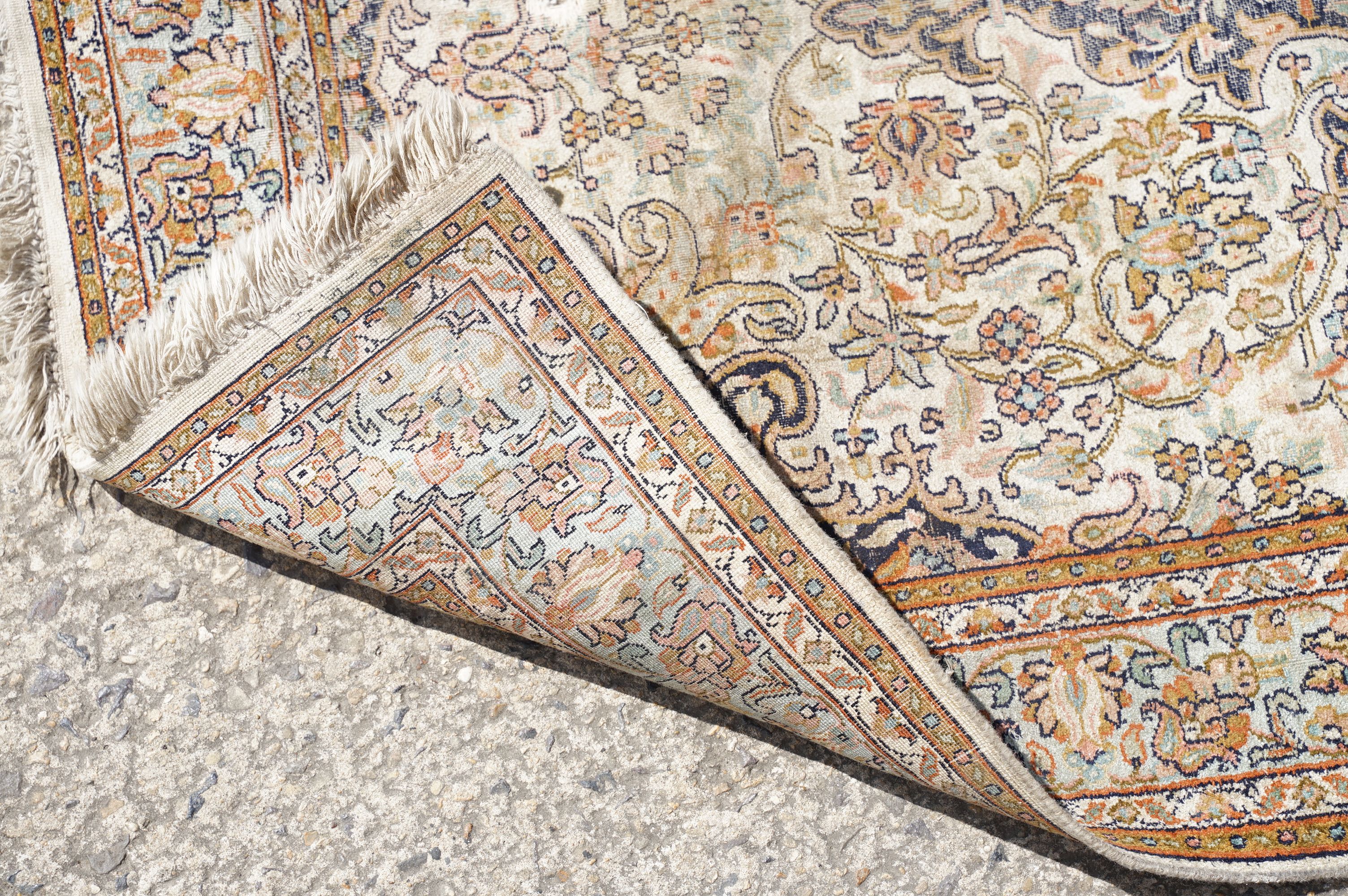 Middle Eastern cream ground carpet, with central stylised motif within geometric borders, 160 x 92cm - Image 8 of 14