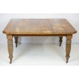 Early 20th century mahogany draw leaf dining table of rectangular form with canted corners on turned