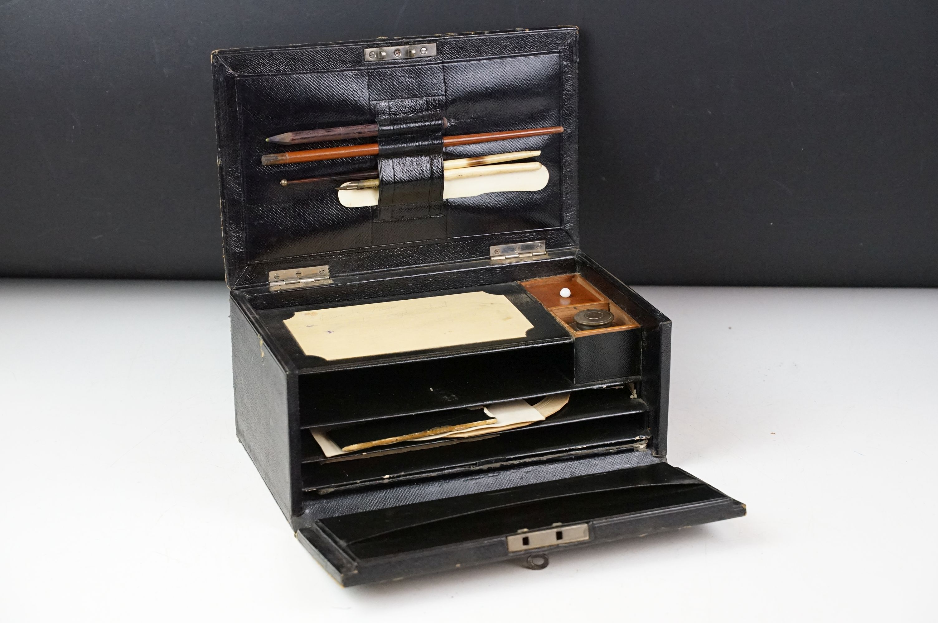 Late 19th / early 20th century leather clad stationery box, the contents to include dip pen,