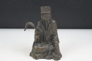 Chinese bronze figure of an old man in traditional dress, approx 17cm tall