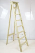 Green painted decorative ladder with seven steps, 174cm high