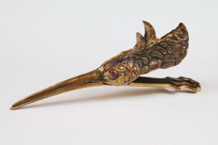 Brass cased document clip in the form of a water bird